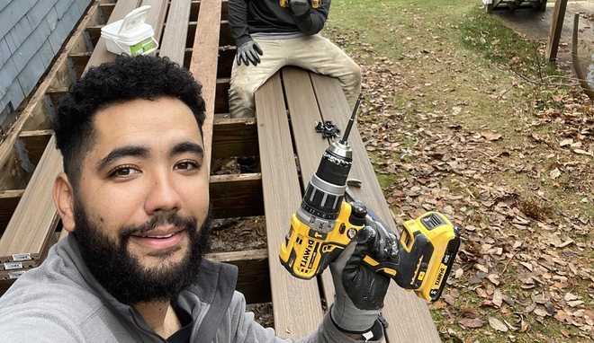Mateus and his crew building a composite deck by a lake