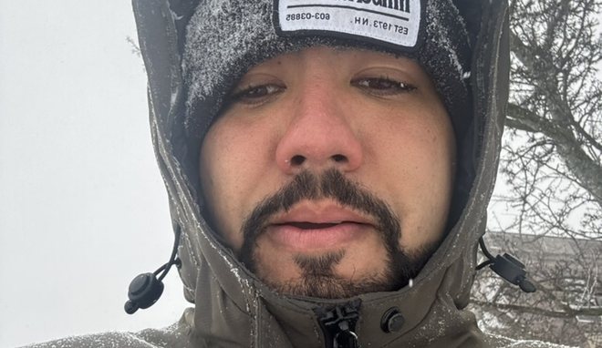 Mateus on a job site in the snow