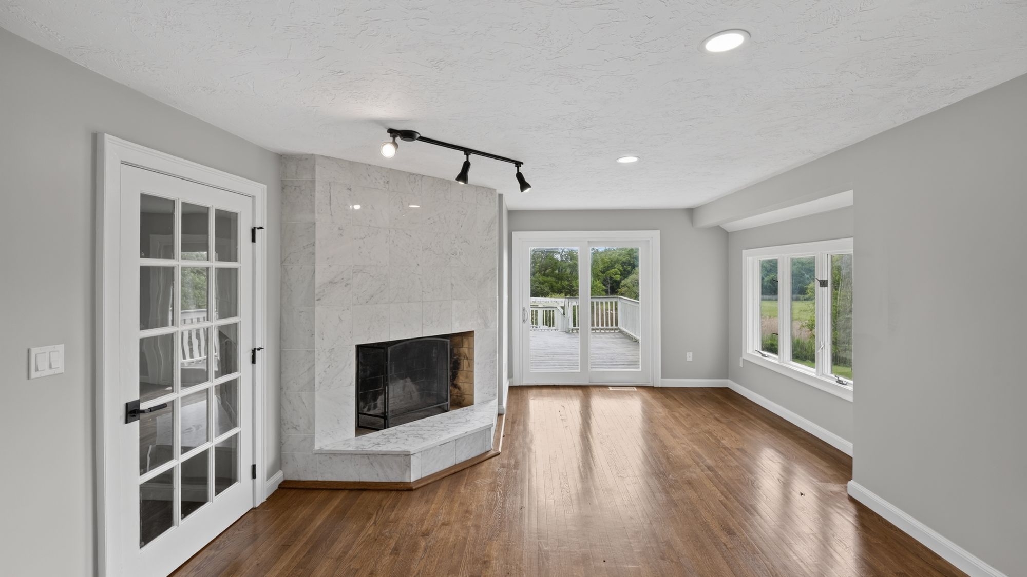 Family room with marble fireplace surround