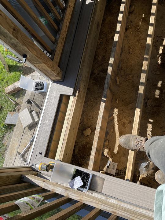 Composite deck boards going down