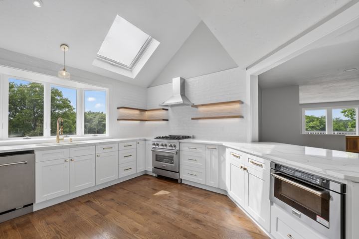 Finished vaulted kitchen with skylight in a full home renovation in Essex, MA