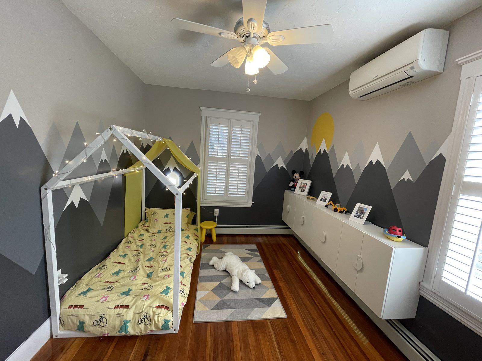 Kids bedroom with mural and custom-built bed