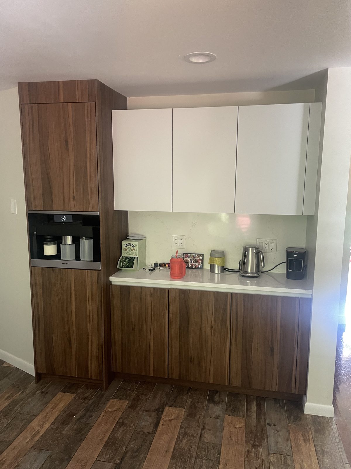 Two-tone kitchen with warm walnut lower cabinets and white uppers